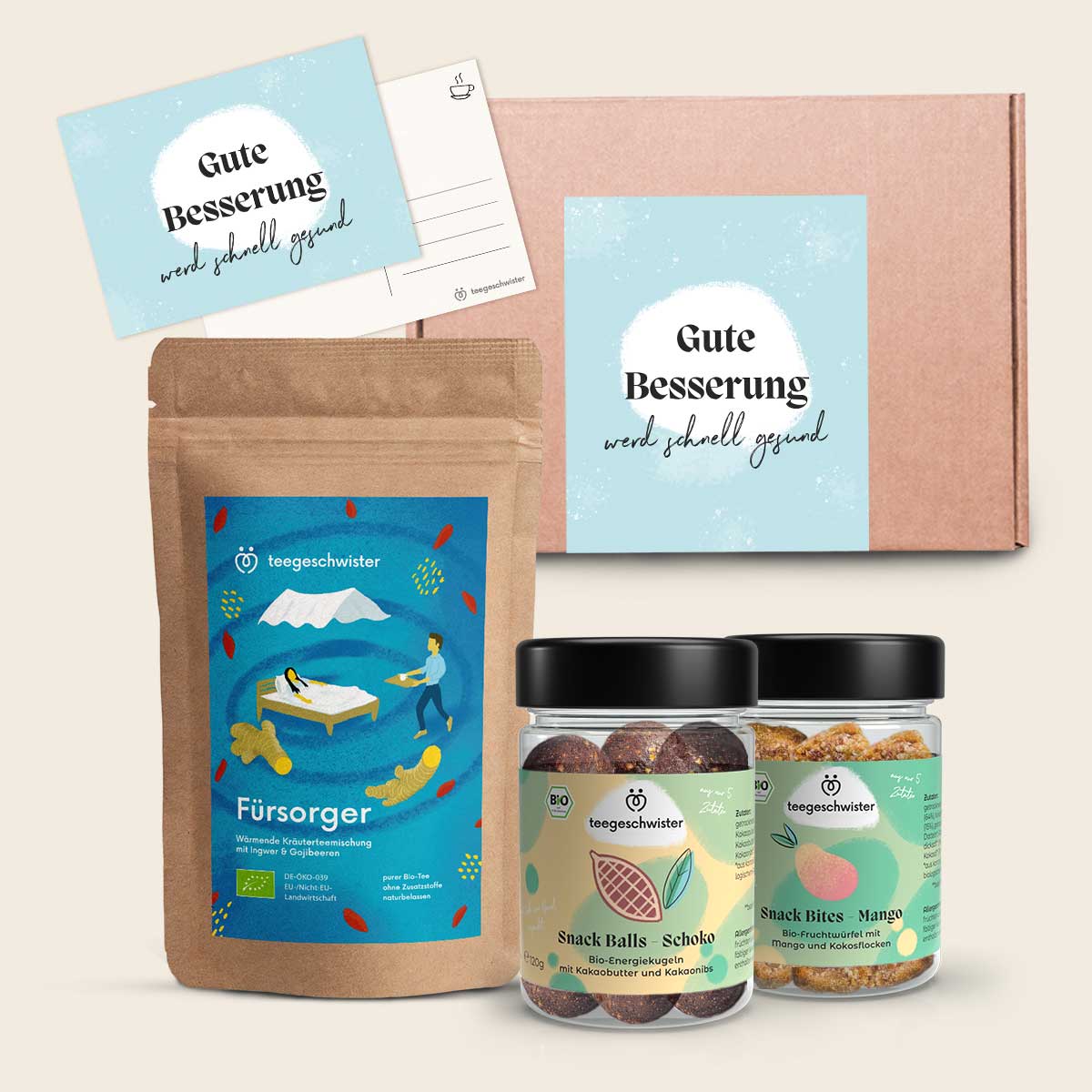 Das Bild zeigt das Gute Besserung Geschenk mit einem Bio Tee und zwei veganen Snacks zur Aufmunterung.